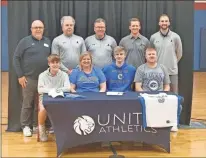  ?? Alex Farrer ?? Unity Christian’s Austin Wilkerson signed a basketball scholarshi­p Thursday with Shorter University.