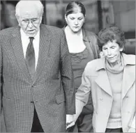  ?? Francine Orr
Los Angeles Times ?? FINANCIAL WOES Emerging from bankruptcy court in 2012 are Schuller and
wife Arvella. Behind them is daughter Carol Milner.