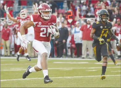  ?? Craven Whitlow/Special to the News-Times ?? On to the end zone: Arkansas running back Devwah Whaley scores on a long touchdown run against Missouri last Friday in Fayettevil­le. On Tuesday, Arkansas announced they have hired two search firms for aid in finding its next athletic director and...