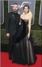  ?? PHOTO BY JORDAN STRAUSS — INVISION — AP ?? Justin Timberlake, left, and Jessica Biel arrive at the 75th annual Golden Globe Awards at the Beverly Hilton Hotel on Sunday in Beverly Hills