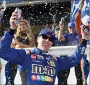  ?? DERIK HAMILTON — THE ASSOCIATED PRESS ?? Kyle Busch celebrates in Victory Lane after winning a NASCAR Cup Series auto race, Sunday, July 29, 2018, in Long Pond, Pa. note at Pocono.