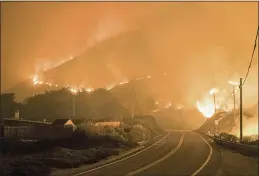  ?? NIC COURY — THE ASSOCIATED PRESS ?? The Colorado Fire burns along Highway 1 near Big Sur on Saturday.