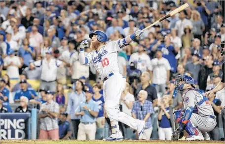  ?? Robert Gauthier Los Angeles Times ?? JUSTIN TURNER watches as his ninth-inning home run gives the Dodgers a 4-1 win over Chicago. “I still can’t believe it,” he said.