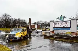  ?? Will Waldron/times Union ?? The westbound entrance to Stuyvesant Plaza was closed after flooding along Western Avenue on March 7 in Guilderlan­d.