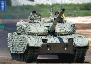  ?? PROVIDED TO CHINA DAILY ?? The VT-5 light-duty tank (top) and VT-4 main battle tank (above) are put through their paces at a demonstrat­ion held on Wednesday by State-owned arms-maker China North Industries Group Corp.