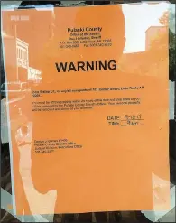  ?? Arkansas Democrat-Gazette/SCOTT CARROLL ?? The Pulaski County sheriff’s office posted an eviction notice Sept. 12 on the front door of Jerky’s Spicy Chicken and More, 521 Center St., Little Rock, possibly closing a long struggle between owner John Walker Jr. and the building owners.