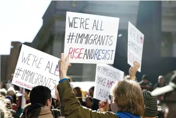  ??  ?? Supporters demonstrat­e outside US Citizenshi­p and Immigratio­n Services offices during a rally to support immigratio­n activist Ravi Ragbir (unseen) in New York. — Reuters photo