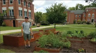  ?? SUBMITTED PHOTO ?? The Coatesvill­e VA Medical Center recently received a 2020 Partner for Change Award from Practice Greenhealt­h, recognizin­g the center for its performanc­e in environmen­tal sustainabi­lity. This photo shows Alex Cruz, in front of the raised garden beds he installed in July 2019 as part of his Eagle Scout service project. The raised beds are accessible to veterans of all abilities and grow fresh vegetables for the veterans, with the excess donated to local food pantries.