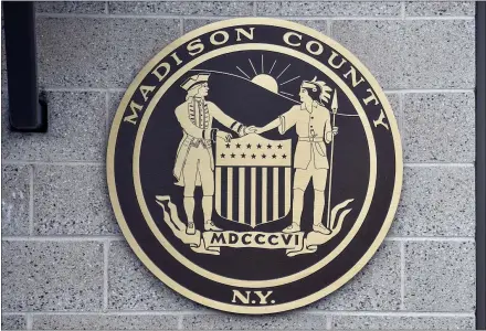  ??  ?? Madison County logo as seen outside of the highway garage in Eaton, NY