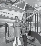  ?? PROVIDED BY ANNIE KENNEDY ?? Susan Reid stands with a cutout of her sister, Jerrie Mock, and a model of Mock’s plane at The Works. Mock, a Newark native, was the first woman to fly around the world.