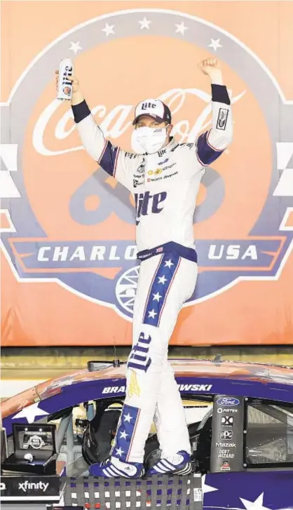  ?? GETTY ?? Brad Keselowski celebrates in Victory Lane at empty Charlotte Motor Speedway after win late Sunday night.