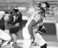  ?? ?? Team Soldier wide receiver Maccai Brave (8) runs for a touchdown during the Cure Classic football game at Showalter Field in Winter Park on Thursday.