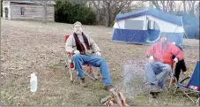  ?? LYNN KUTTER ENTERPRISE-LEADER ?? Bob Chisum, left, and his son, Amos Chisum, both of West Fork, participat­ed in the first Anniversar­y of the Battle of Prairie Grove Campout. The park provided firewood, dinner and breakfast the next morning. About 15 people camped out on a Friday night.