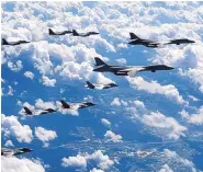  ?? SOURCE: SOUTH KOREA DEFENSE MINISTRY ?? U.S. Air Force B-1B bombers, F-35B stealth fighter jets and South Korean F-15K fighter jets fly over the Korean Peninsula during a joint drill on Monday.