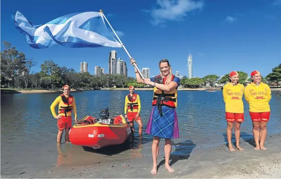  ?? Picture: PA. ?? Eilidh Doyle proudly waves the saltire after being named the flag bearer for Scotland at the Commonweal­th Games opening ceremony.