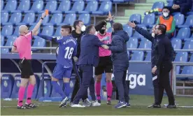  ??  ?? Referee Pablo González Fuertes (left) shows a red card to José Bordalás in the dying moments of Getafe’s 1-0 defeat by Real Sociedad. Photograph: Anadolu Agency/Getty Images