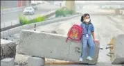  ?? BIPLOV BHUYAN/HT ?? A girl wears a pollution mask in New Delhi. Pneumonia killed an estimated 126,535 children under the age of five in India in 2017, of which 27% were attributab­le to air pollution.