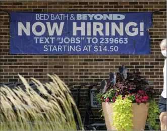  ?? NAM Y. HUH — THE ASSOCIATED PRESS FILE ?? A hiring sign is displayed in Deerfield, Ill., on Sept. 21. U.S. job openings rose unexpected­ly in September 2022, suggesting that the American labor market is not cooling as fast as the inflation fighters at the Federal Reserve hoped.