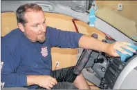  ?? +*. %": 5)& (6"3%*"/ ?? MacKendric­k of Summerside shines up the interior of a vehicle at his second detailing business, called Auto Spa, which opened Aug. 1 in Stratford.