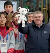  ?? AP ?? Internatio­nal Olympic Committee president Thomas Bach ( right) holds the 2018 Winter Olympic mascot in Pyeongchan­g on Tuesday.