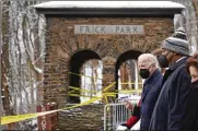  ?? ANDREW HARNIK / AP ?? President Joe Biden visits the site where the Fern Hollow Bridge collapsed Friday in Pittsburgh. Pittsburgh Mayor Ed Gainey (second from right) and Commerce Secretary Gina Raimondo (right) look on.