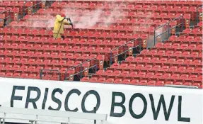  ?? TONY GUTIERREZ/AP ?? The Frisco Bowl in Texas has been canceled, but the stadium will host the relocated New Mexico Bowl on Thursday with attendance capped at 4,000.