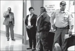  ?? Arkansas Online/ EMMA PETTIT ?? Arkansas Department of Correction spokesman Solomon Graves ( left) walks back into the media center at the Cummins Unit after getting an update on the scheduled execution of Ledell Lee.