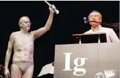  ??  ?? Atsugi Higashiyam­a of Japan accepts the 2016 Ig Nobel Prize in Perception.