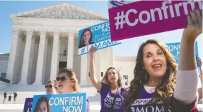  ?? Drew Angerer / Gett y Imag es ?? Supporters of Supreme Court nominee Judge Amy Coney Barrett demonstrat­e Thursday outside the court in Washington, D.C.