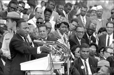  ?? ASSOCIATED PRESS FILE PHOTO (1963) ?? The Rev.
Dr. Martin Luther King Jr., head of the Southern Christian Leadership Conference, gestures while speaking to thousands in attendance during his “I Have a Dream” speech on Aug. 28, 1963, in front of the Lincoln Memorial in Washington, D.C.