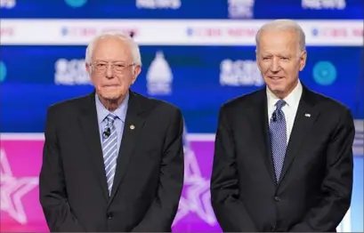  ?? Erin Schaff/The New York Times ?? Democratic presidenti­al candidates Bernie Sanders and Joe Biden appear Feb. 25 at a primary debate in Charleston, S.C.
