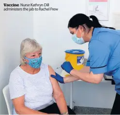  ??  ?? Vaccine Nurse Kathryn Dill administer­s the jab to Rachel Frew