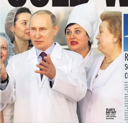  ??  ?? VLAD’S DAY OUT Putin poses with workers yesterday