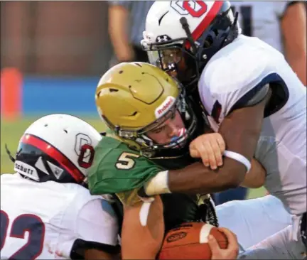  ?? BOB RAINES — DIGITAL FIRST MEDIA ?? Lansdale Catholic’s Danny Dutkiewicz gets swamped by O’Hara’s defense Saturday.