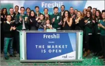  ?? MARK BLINCH, TMX GROUP LTD. ?? Matthew Corrin, centre, founder and CEO of Freshii, is surrounded by friends, family and employees at the opening of trading Tuesday of the company’s shares on the Toronto Stock Exchange.