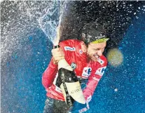  ??  ?? Champagne moments: Simon Yates celebrates his victory in the 73rd Vuelta a Espana, and (right) leading the pack