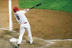  ?? MATT SLOCUM — THE ASSOCIATED PRESS ?? The Phillies’ Jay Bruce follows through after hitting a home run off Nationals pitcher Max Scherzer during the sixth inning Wednesday in Philadelph­ia.