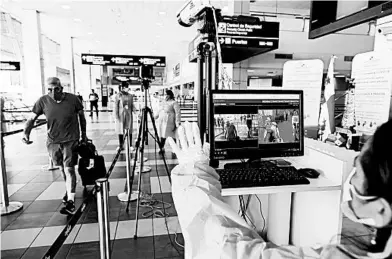  ?? ARNULFO FRANCO/AP ?? Thermal cameras are being tested in airports as a means to try to slow the spread of the coronaviru­s by taking travelers’ temperatur­e.