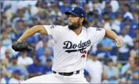  ?? DAVID J. PHILLIP — THE ASSOCIATED PRESS ?? Los Angeles Dodgers starting pitcher Clayton Kershaw throws during the first inning of Game 1of baseball’s World Series against the Houston Astros Tuesday in Los Angeles.