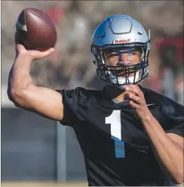  ?? L.E. BASKOW ?? UNLV quarterbac­k Armani Rogers looks downfield during a spring practice. A national magazine has favorably compared the redshirt freshman to the NFL’S Cam Newton.