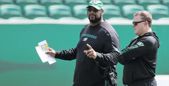  ?? TROY FLEECE ?? Roughrider­s offensive co-ordinator Stephen Mcadoo, left, says his job is to help head coach Chris Jones win games, and a deep passing attack isn’t always the best way to do that.
