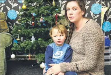  ?? Picture: Andy Payton FM4627419 ?? Nicola Wilson and son Harvey, two. She plugged the Christmas tree lights into a damp socket behind the sofa, which knocked her across the room