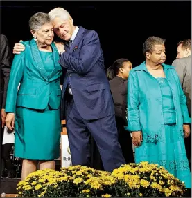  ?? Arkansas Democrat-Gazette/MITCHELL PE MASILUN ?? Former President Bill Clinton embraces Carlotta Walls LaNier, one of the Little Rock Nine, at the end of the commemorat­ion ceremony Monday on the 60th anniversar­y of desegregat­ion at Little Rock Central High School. Another Little Rock Nine member...
