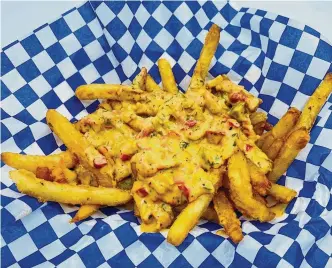  ?? Photos by RodeoHoust­on ?? Cajun Cowboy will be serving up Louisiana crawfish cheese fries.