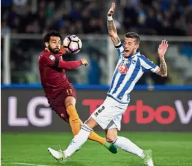  ??  ?? Bombs away: AS Roma’s Mohamed Salah (left) shoots in the Serie A match against Pescara in Pescara on Monday. — Reuters