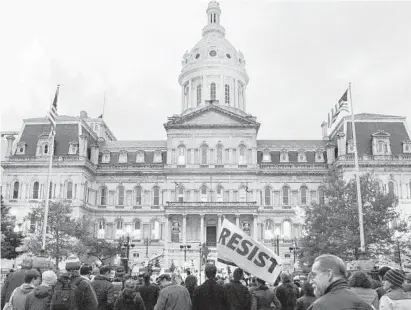  ?? ULYSSES MUNOZ/BALTIMORE SUN ?? At the “Nobody is Above the Law” rally at City Hall at 5 p.m., a crows protests the replacemen­t of Deputy Attorney General Rod Rosenstein with just-named Acting Attorney General Matt Whitaker as special counsel Robert Mueller’s boss.