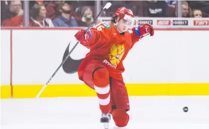  ?? DARRYL DYCK/THE CANADIAN PRESS FILES ?? Russia's Alexander Romanov celebrates his goal against Denmark during the 2019 IIHF world junior hockey championsh­ips in Vancouver. Romanov was one of the five fastest skaters in the KHL, and he doesn't shy away from physical play.