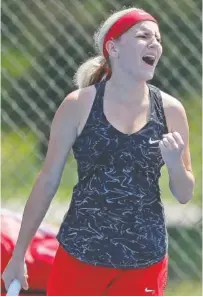  ??  ?? Signal Mountain’s Cathryn Trombley celebrates after winning a point during her tennis match against L&N Stem’s Sonya Edwards. Trombley won in three sets.