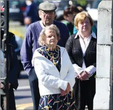  ?? Photo by Michelle Cooper Galvin ?? Parishione­rs Anna O’Neill, Pat and Mary Curran at the funeral of Canon Michael Fleming as its received at St James’ Church, KIllorglin on Tuesday.