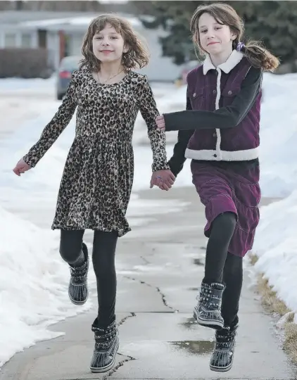  ?? Photos: ED KAISER/ EDMONTO N JOURNAL ?? Laura, left, and Sarah Harder, 11, “think it’s cool to be twins,” but like their own style.